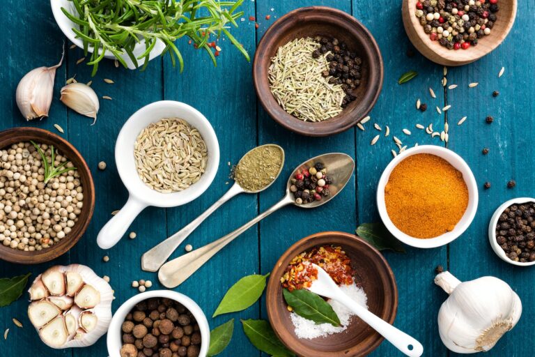 culinary background with spices on wooden table