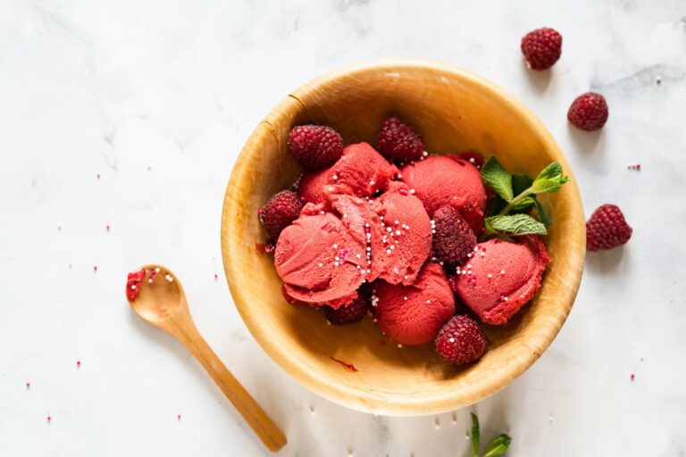 Delicious raspberry sorbet in wooden bowl