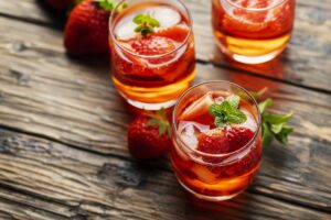 Fresh summer cocktail with ice, strawberry and mint