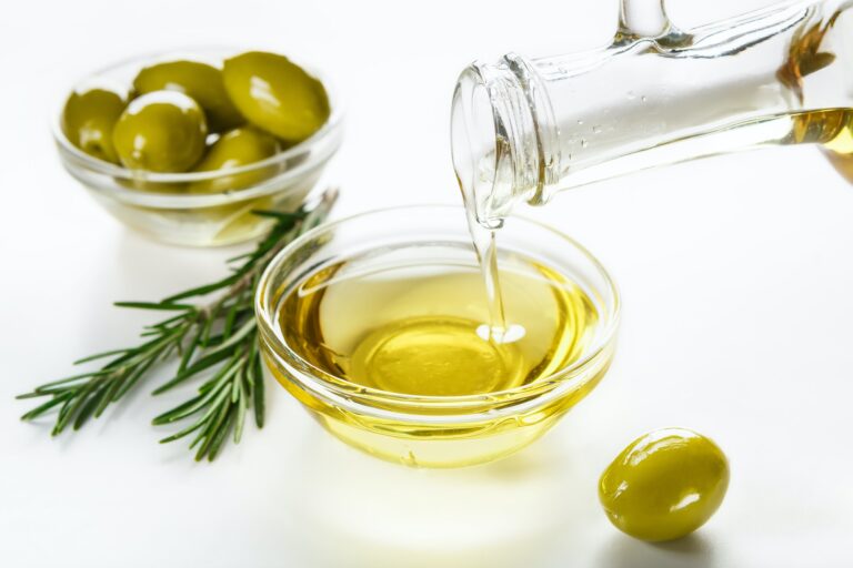 Olive oil and olives in bowls